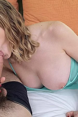 Smiling fem Anya Amsel is holding dick between boobs and then fucking it