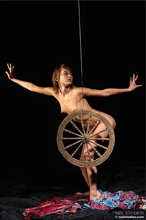 Slim short haired brunette with perky boobs Lera MPL poses nude on the set