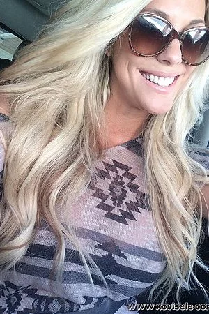 Blonde chippy in sun glasses Xo Gisele playfully shows her amazing big melons