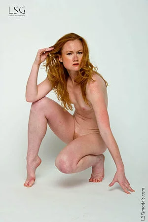 Flat chested girl Susie B with small pink nipples and bushy pussy poses naked