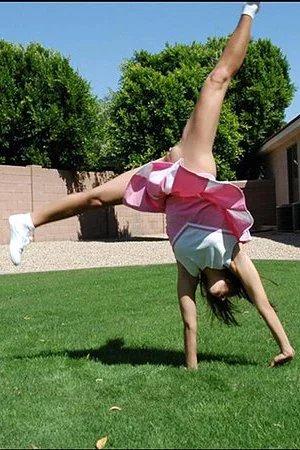 Jordan Capri with small tits and bald pussy removes everything apart from her tiny pink skirt