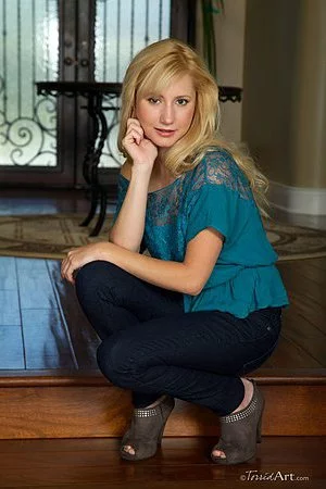 Petite blonde Odette Karups with A size tits and tight clean pussy strips naked and shows it all