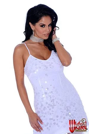 This is the luxurious brunette milf Mikayla that is posing in incredible dress