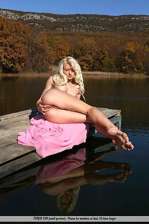 When doing yoga outdoor the horny blonde Nika N is getting nude and masturbates