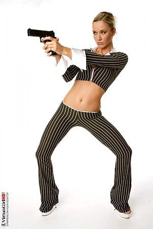 The blonde girl Carmen Cocks has lost off her striped costume and posed with the gun