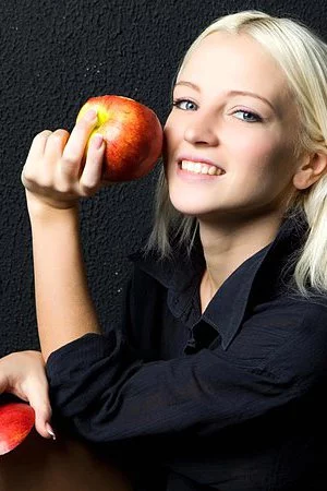 Sexy blonde Alysha A bends over and approaches her shaved slits to the camera