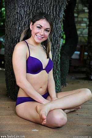 Sexy brunette Taylor Lain loses off her lingerie and shows naked pussy and boobs