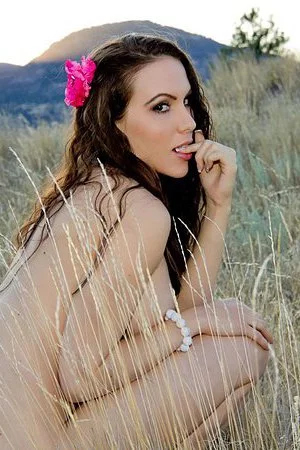 You will love brunette busty model Katie Banks as she is posing outdoors.