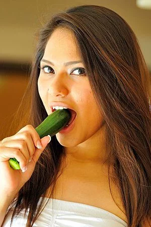 Tiny titted brunette Eva Fenix exposes her shaved spot after she pulls off her blue panties