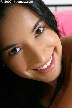 Slim brunette Elizabeth Minici peels off her white bikini in bed and exposes her hairy snatch