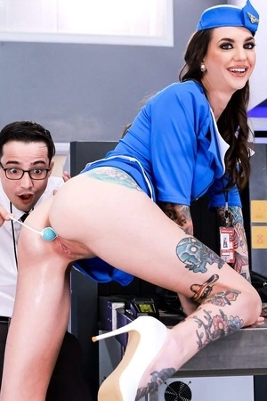 Tattooed stewardess Rocky Emerson gets fucked by younger dude