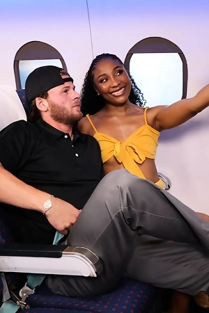 Curly-haired ebony with small cans gets banged on plane