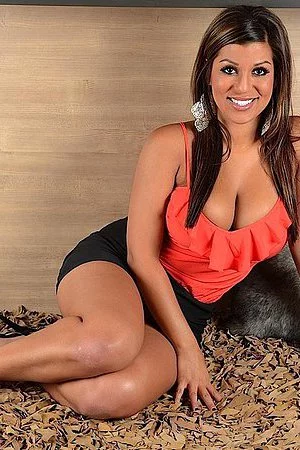 Tattooed Briana Lee is wearing nothing but her nice smile in this popular gallery.