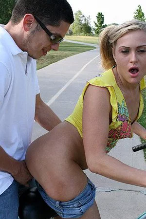 Guy pulls Ruby Ryder's pigtails while fucking her moist pussy from behind