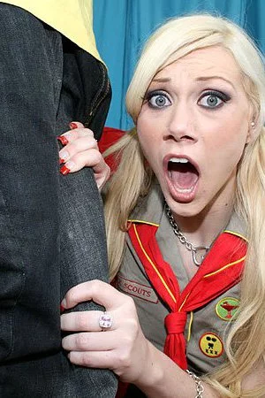 Blonde-haired girl scout Samantha Sin shows her bald twat and puts her lips on giant black dick