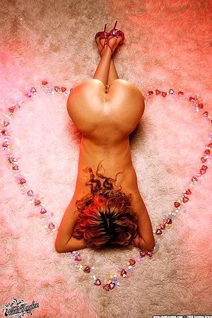 Long legged babe Prinzzess Sahara toys her pussy in the middle of the heart