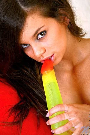 Iris Nubiles strips off her pink underwear and sticks big green dildo in her teen love box