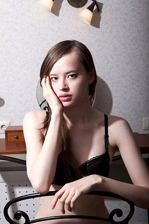 Brunette cutie Kitana A exposes her shaved snatch and touches her clit for us