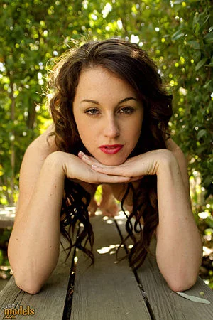 Bella XoXo removes her white lingerie and shows her sexy bald pussy outside