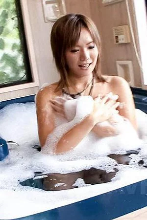 Licentious Asian chick Mei Hitomi mercilessly packs her very hairy cunt with the sex stuff