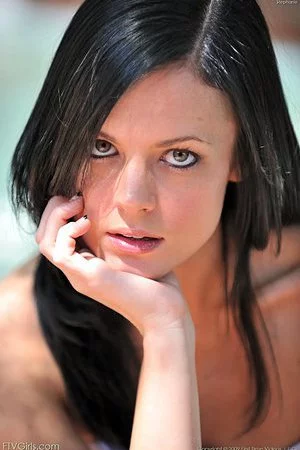 Playful brunette teen Stephanie FTV in dress and thong panties flashes her slit outdoors