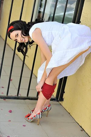 Brunette babe Sophie FTV in white dress takes off her red panties outdoors