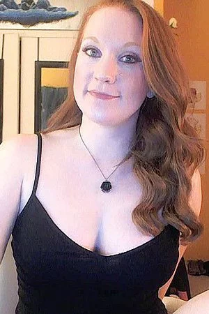 Big boobed redhead Lucy OHara squeezes her boobs and dildos her ripe pussy