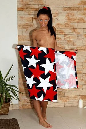 Hot brunette Gina Devine takes a shower and squeezes her pussy by clothes pins