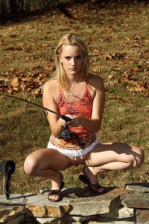 Blonde babe Sara James goes out fishing and ends up stripping for the camera