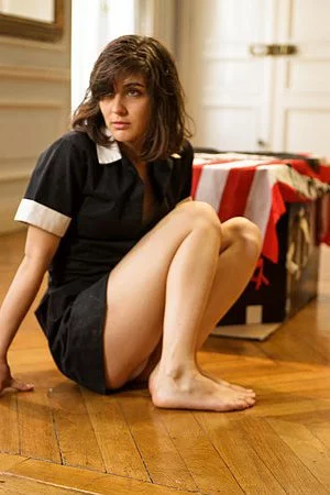 Locked in the big hall sexy housemaid Leonda A takes off her uniform dress