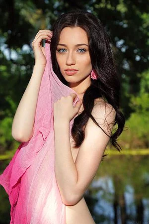 Lecherous brunette Zsanett Tormay poses outdoors with her tits and pussy exposed