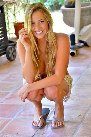 Heavenly blondie Courtney Dillon sticks that enormous blue dildo in her gash and works it