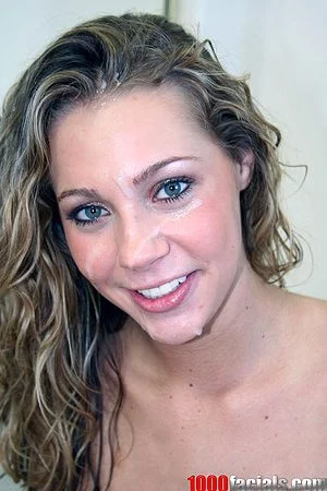 Blue eyed cocksucker Mysti May with curly hair gets cum all over her pretty face