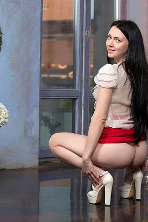 Brunette babe Liuko A removes all her clothes and poses around the house