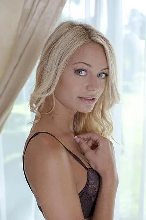 Seducing teenie Vanessa J slowly tripping off lingerie and taking erotic poses