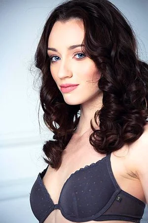 Charming brunette doll Zsanett Tormay exposes her big erected clit between shaved nub lips