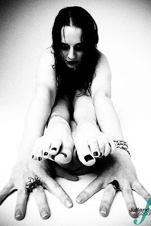 Here are black and white pics of nude flexible fetish model Claire Adams with jet black hair