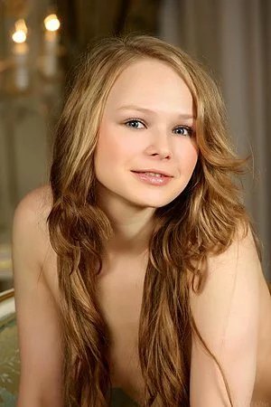 Flirty and spicy blondie Mia C wants you to check out her creamy bod and shaved pussy