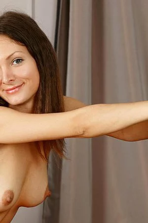 Superb brunette chick Zhanet A shows off her creamy skin and her shaved pussy for us