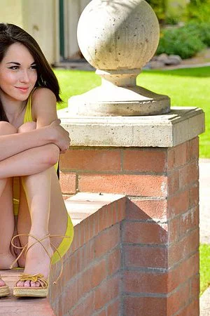 Kinky chick Emily Grey loses off her yellow dress and exposes nude teenage charms outdoor