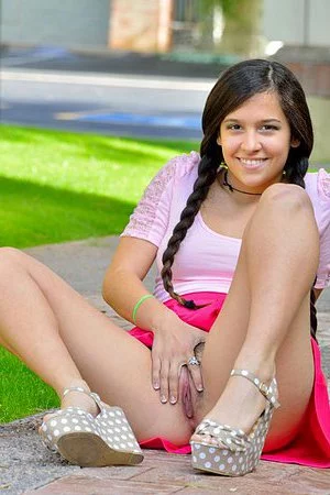 Naughty Latin chick Caroline Ray lifts her skirt up and dildo pounds the beaver outdoor