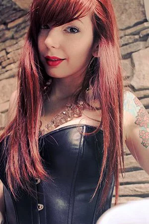 Wild fetish babe Ivy Jean poses in a sexy corset and shows us how naughty she is