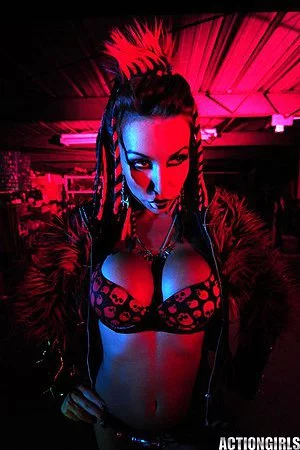 Big racked fetish lady Kobe Kaige with crazy make-up does some modeling in the dark