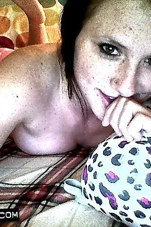 Being a super hot tease brunette Freckles is wearing pink clothes and sucking on a sex toy