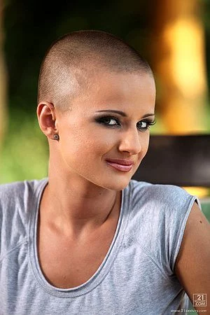 Charming short haired porn model Sinead in mini skirt and sneaks makes her eyes on you