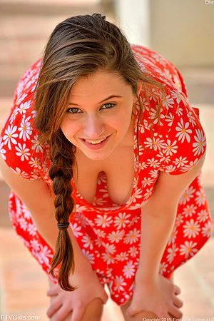 Beauty young brunette Elektra Rose is sitting in red summer dress on stairs outdoors and fucking with dildo 