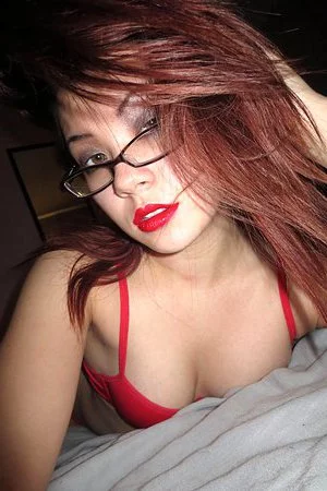 Hot looking oriental slut Sydney Mai is playing with her luxurious red lingerie