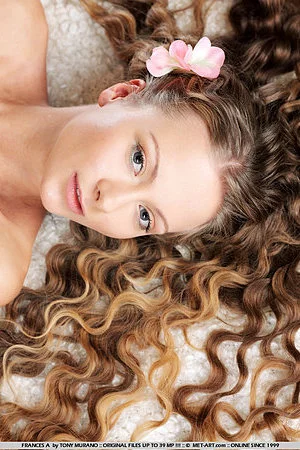 Glamorous curly haired babe Frances A demonstrates her hot shaved pussy