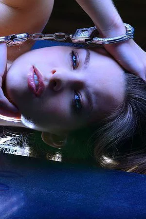 Flexible skinny european girl Kim Nubiles is totally naked in handcuffs