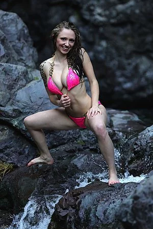 Alluring Lily Xo takes off her sexy pink bikini in front of the camera outdoor